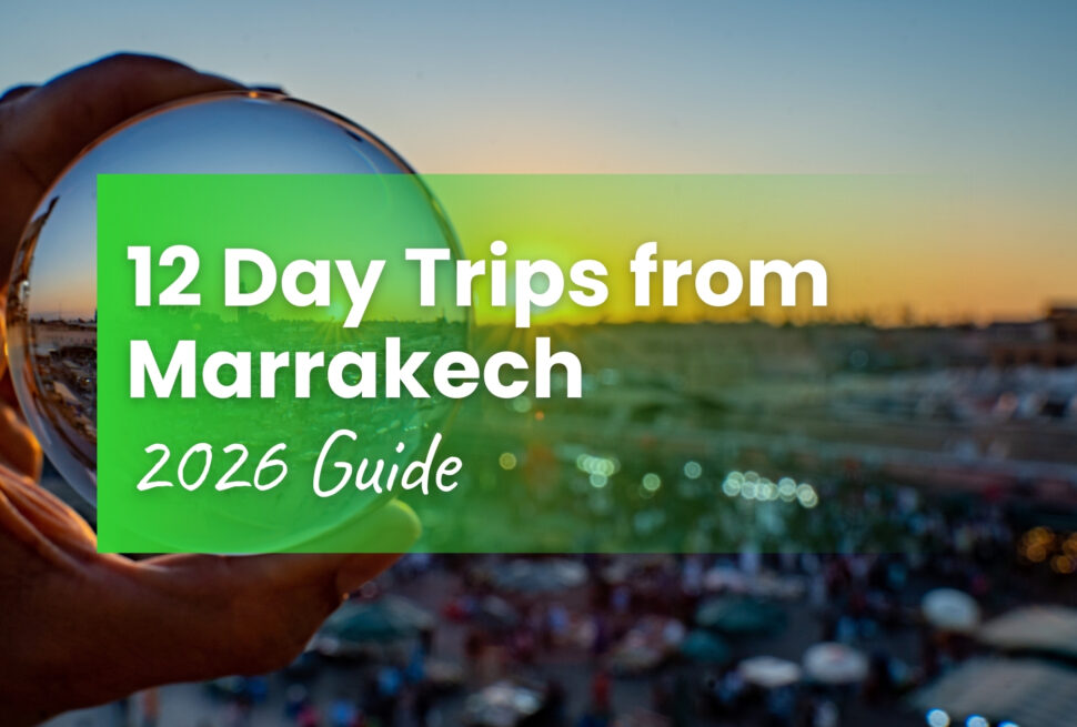 Hand holding crystal ball reflecting Djemaa el-Fna square at sunset — 12 day trips from Marrakech