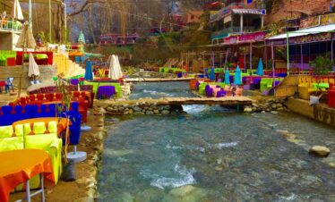 Colorful riverside restaurants along the Ourika Valley river on a day trip from Marrakech