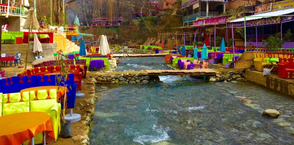 Colorful riverside restaurants along the Ourika Valley river on a day trip from Marrakech